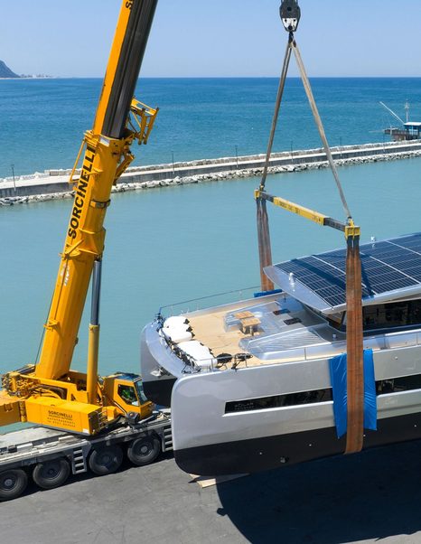 Bow of Silent Yachts SY80 catamaran being lowered into water