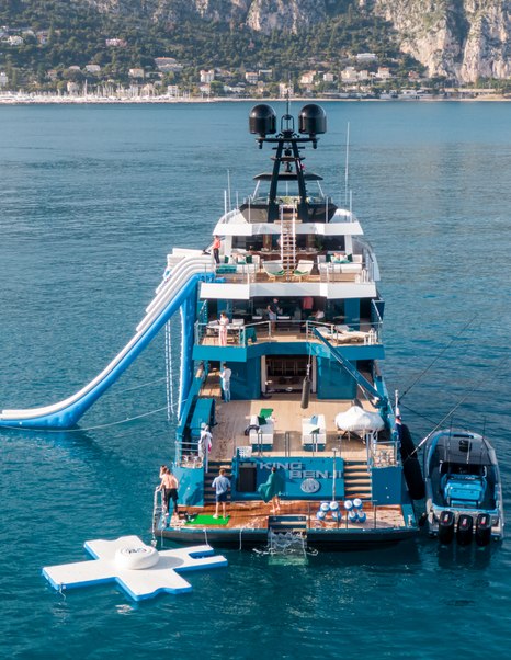 Expedition Yacht King Benji aft with workers and inflatable slide 