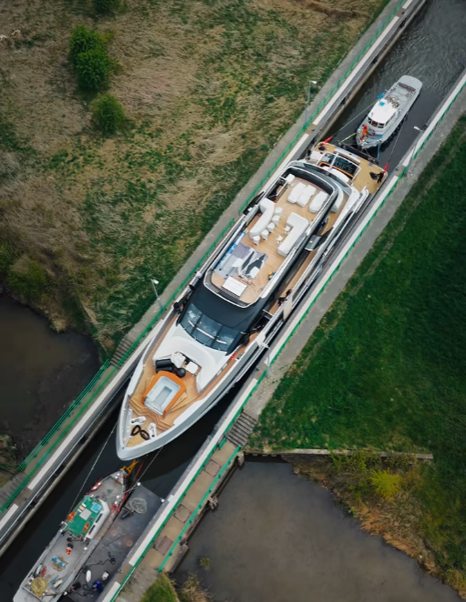 Aerial view of Van der Valk 40m Superyacht Shine going through Dutch canals 