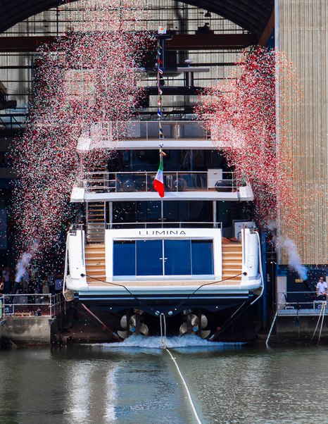 Stern shot of Benetti Class 44M Superyacht Lumina at launch with confetti