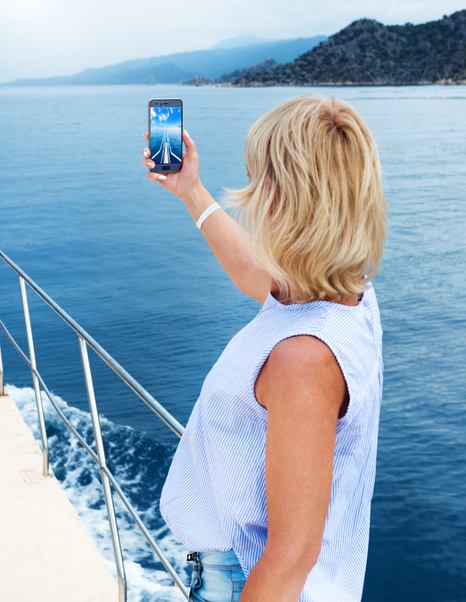 Yacht traveler checking yacht in social media