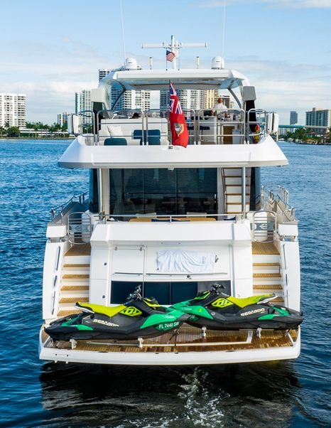 Motor yacht Mandala's aft at anchor