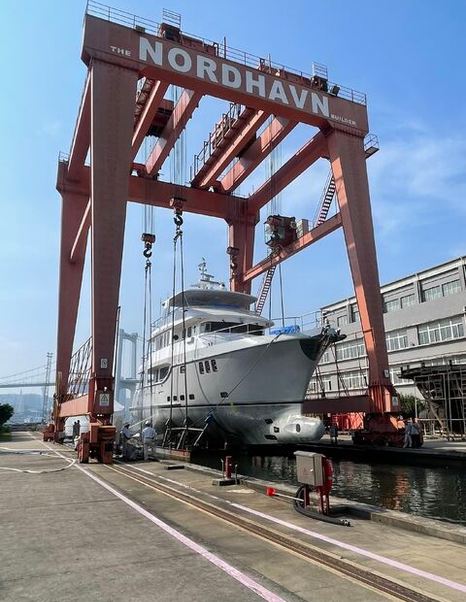 Fifth Nordhavn 80 Motor Yacht on cradle lowered into water