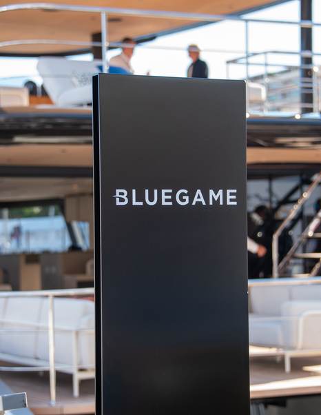 Bluegame stand in front of superyacht docked at the 2025 Monaco Yacht Show