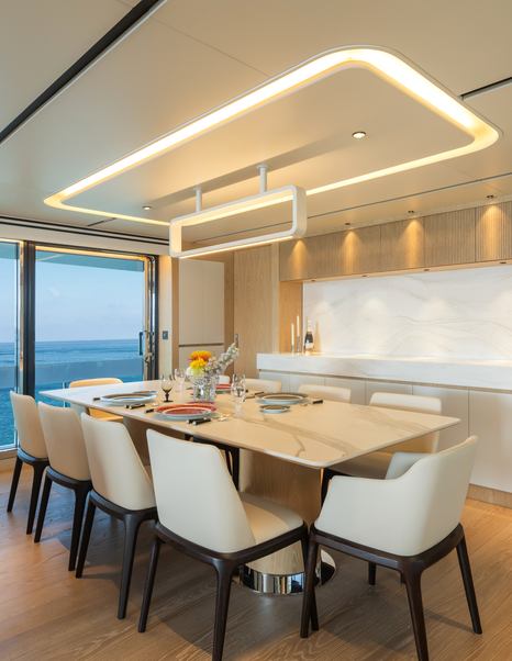 Seventh Horizon FD110 motor yacht dining area with warm square integrated ceiling light 