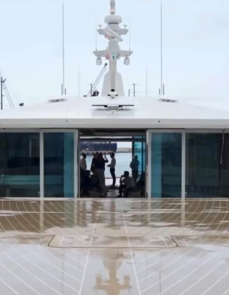 Close up of Alia Superyacht Genie Blu upper deck with glass sliding doors 