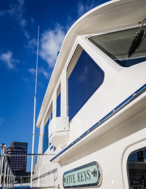 Fleming 85 pilothouse windows and side deck detail with traditional yacht styling
