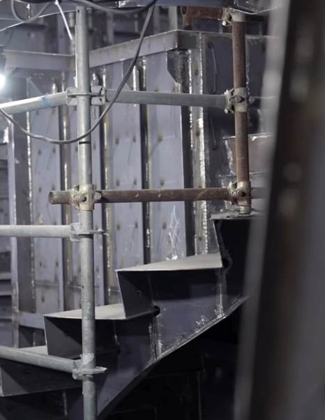 Cantieri di Pisa's 40m Custom Superyacht interior staircase under construction in black and white