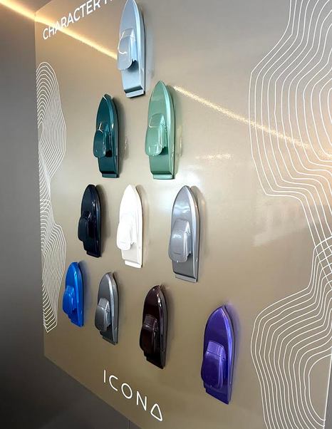 Models of ICONA 70 Motor Yacht on wall in different colours at Cannes 2026