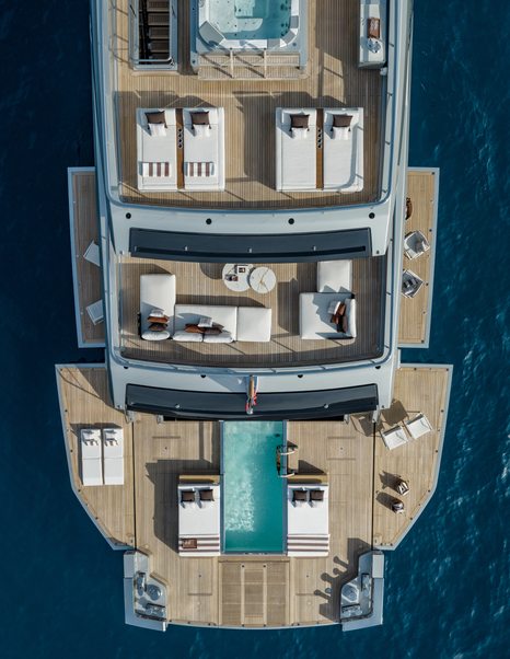 Aerial view of Riva 54Metri Superyacht Sairu aft decks with fold out side terrace and multiple lounging areas 