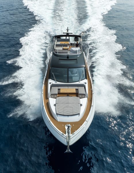 Forward view of the Sunseeker 75 Sport Yacht underway, looking directly at the bow with sunpads.