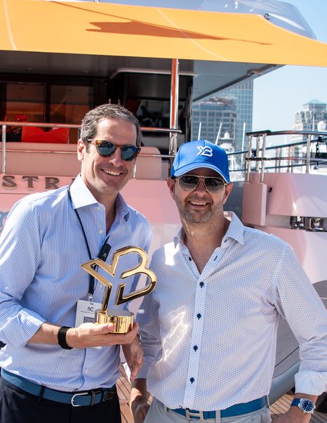 Michel Chryssicopoulos of IYC holding YachtBuyer Broker Award and Kevin Bodington of YachtBuyer 