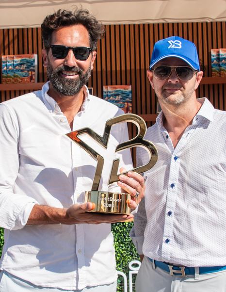 Bob Dension, CEO of Denison Yachts holding YB Brokerage Award next to Kevin Bodington, CEO & Founder of YachtBuyer