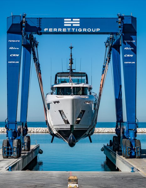 Fifth Custom Line Navetta 38 motor yacht bow at launch being lowered into water