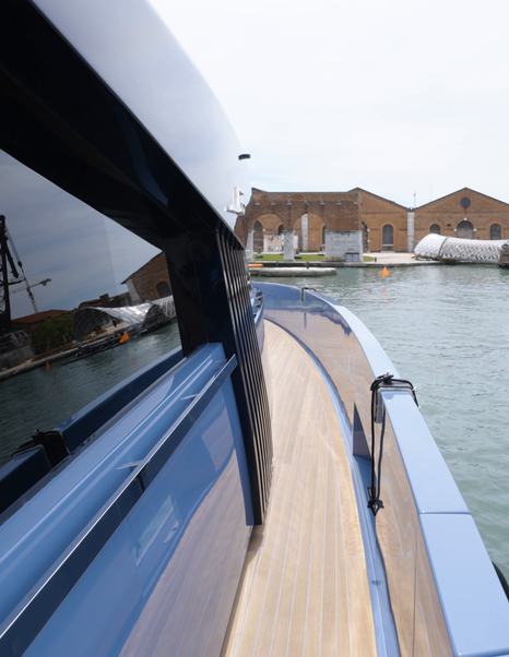 Manda S07 Berlinetta side deck walkway with integrated handrail and flush teak decking