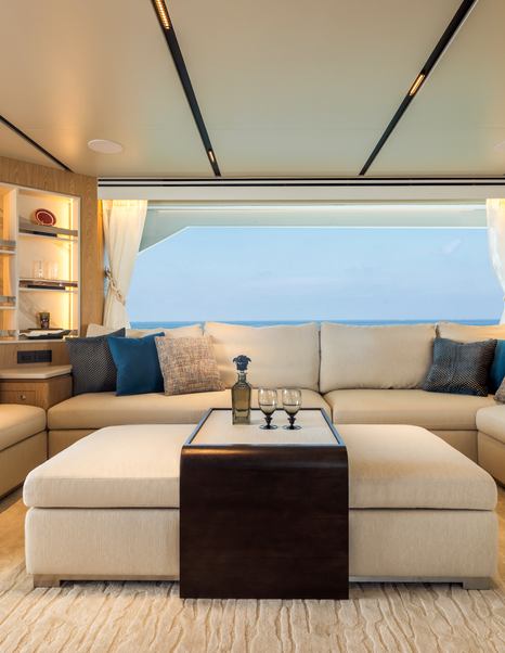 Seventh Horizon FD110 motor yacht main saloon plush white coffee table and with wooden accents