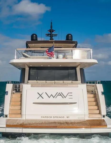 Motor yacht Xwave's aft decks under way