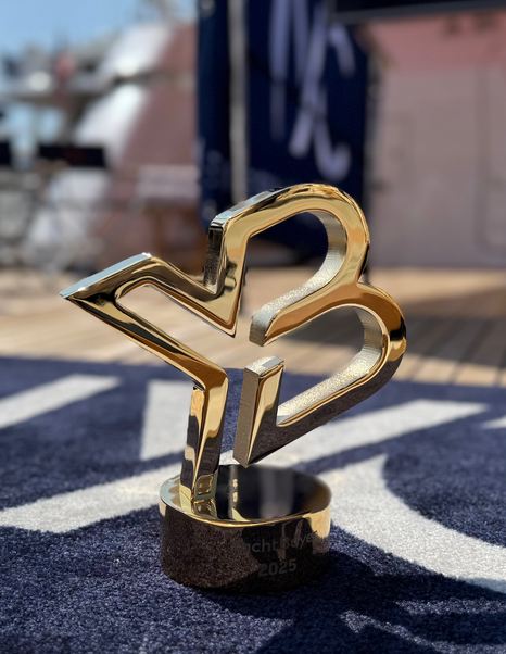 YachtBuyer Gold Broker award on IYC rug at boat show