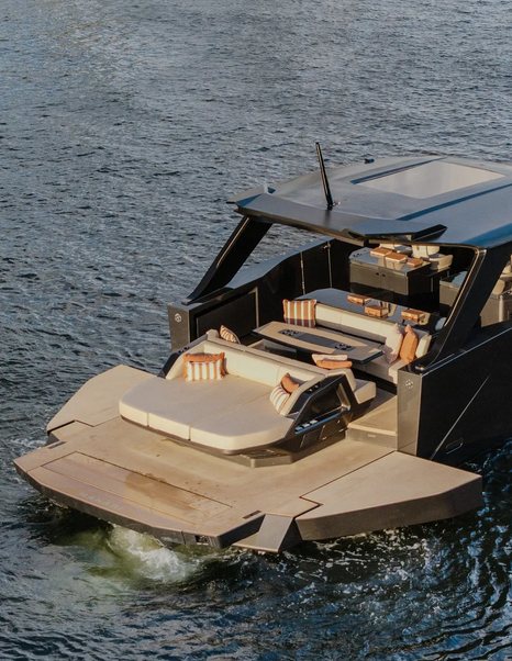 Manari 52 boat aft with fold out side balcony and large beige sunpad 