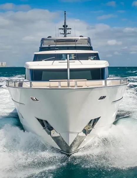 Motor yacht Xwave's bow under way