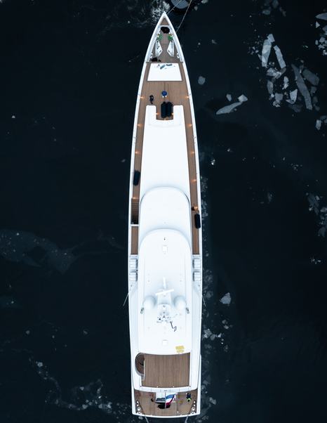 Aerial view of 50m Feadship superyacht Graycliffs under way through broken ice