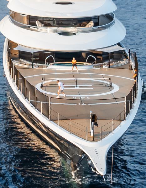 Superyacht Kismet foredeck with people playing in games court
