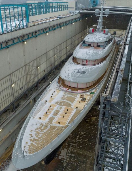 Close up of 102m Lürssen Superyacht Jassi curved upper decks inside floating shed