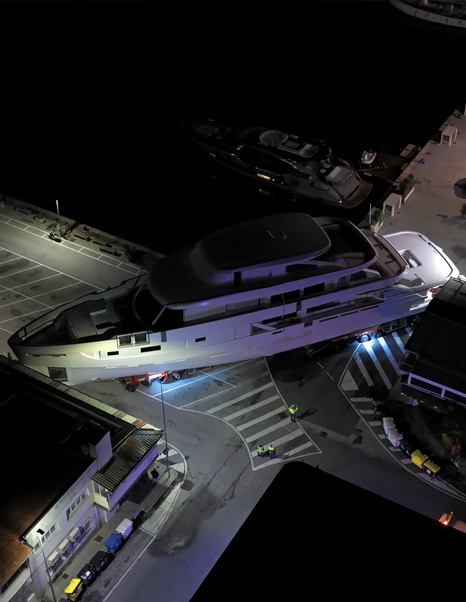 Aerial view of Azimut Grande 44M superyacht under construction navigating narrow roads 