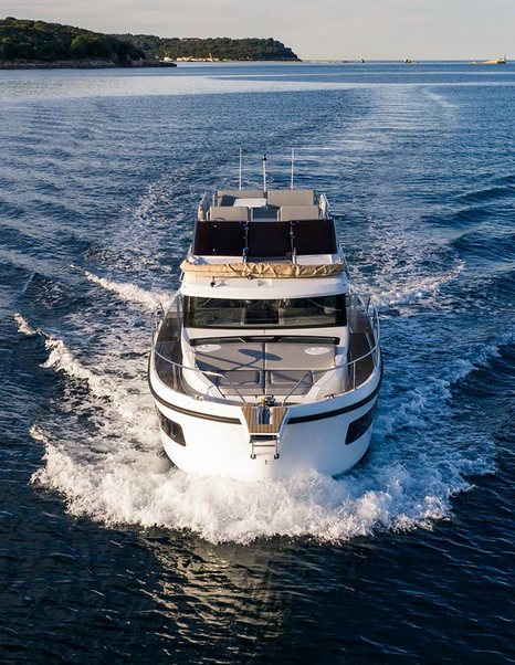 Updated Delphia 11 Flylounge Motor Yacht bow under way 