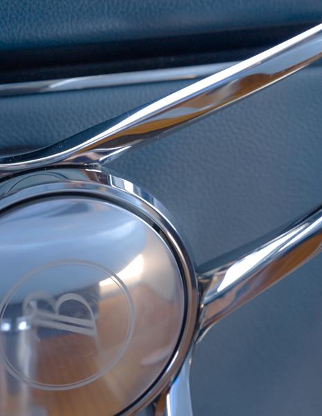 Benetti Oasis 34M steering wheel detail featuring the self-levelling Benetti emblem at the helm.