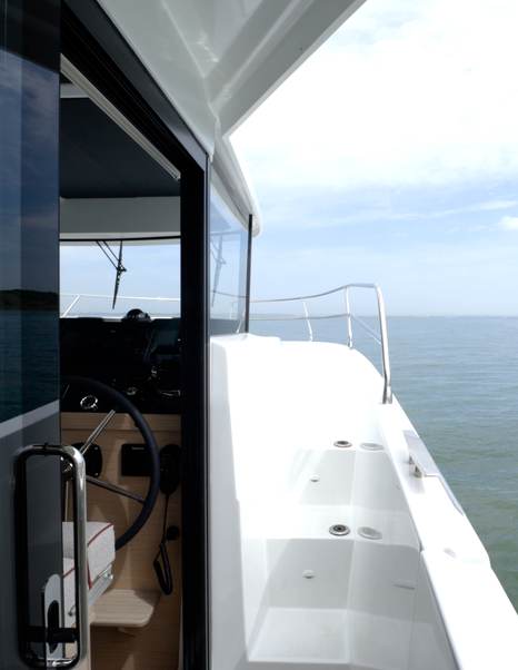 Moulded foredeck steps beside the lower helm on the Beneteau Swift Trawler 37 Fly