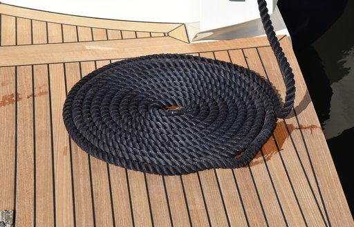 Coiled mooring line on deck of superyacht