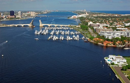 Aerial view of Town Marina – Palm Beach, motor yachts at moorings, surrounded by sea