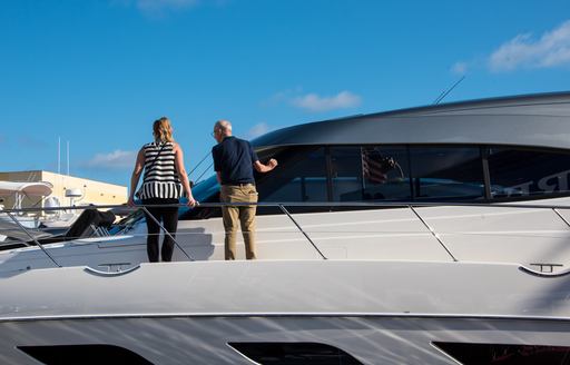 Prospective buyers viewing a motor yacht