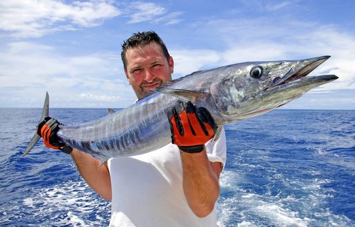 man with big game fish