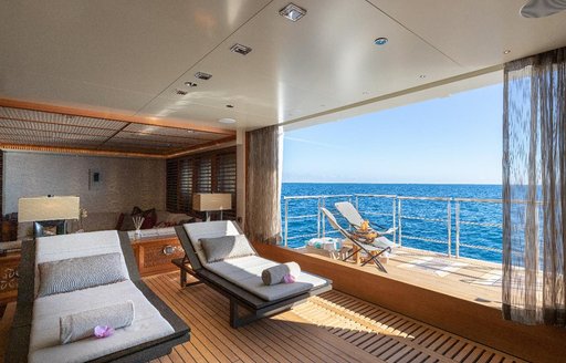 Spa environment onboard superyacht Quantum of Solace with fold down balcony and sun lounger.