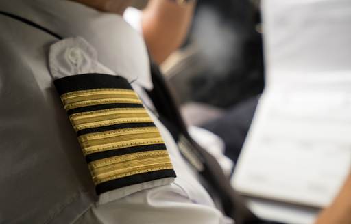 Epaulette on shoulder indicates the role of captains and officers onboard superyachts