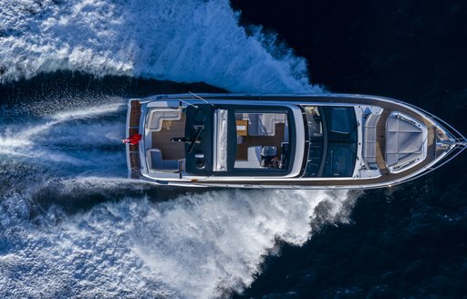 Aerial view of Pearl 62 flybridge yacht underway, surrounded by sea