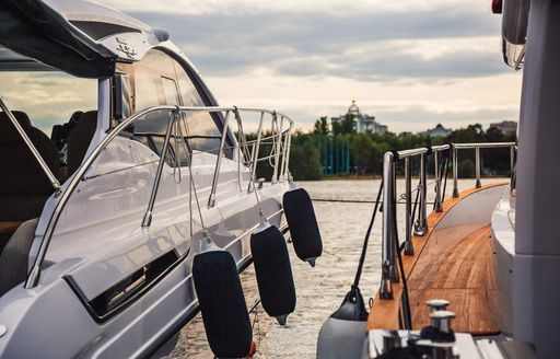 well placed fenders on small motor cruiser yacht