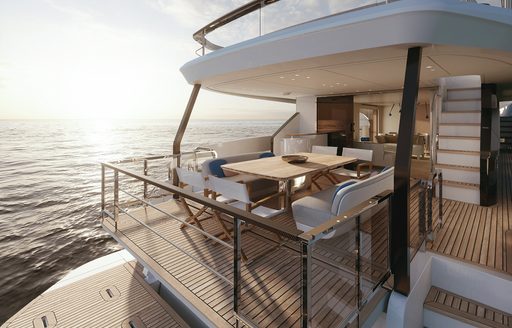 Aft view of Azimut Grande 26 Metri, exterior seating area on aft main deck, overlooking the stern.