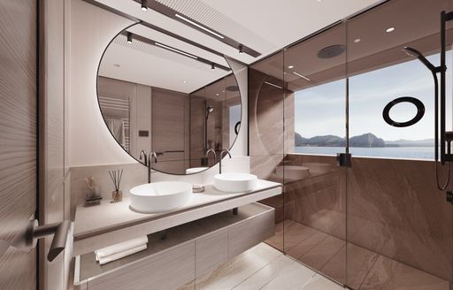 The owner's bathroom onboard the Princess X90 boasts a large round mirror and a spacious shower