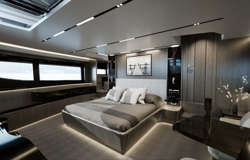 Overview of master cabin onboard Pearl 82, central berth facing forward with wide windows to port and nightstand starboard.