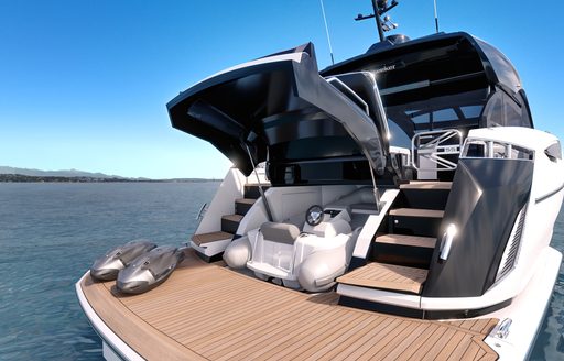 Sunseeker Predator 55 for sale at Fort Lauderdale International Boat Show, aft deck shot showing transom door lifted and tender stowed