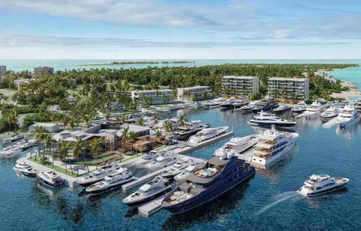 Overview of  Hurricane Hole Superyacht Marina at Paradise Landing, with many superyachts docked, surrounded by sea and hotels