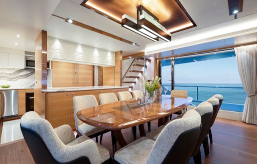 Formal dining area on Crowned Eagle with glass doors adjacent