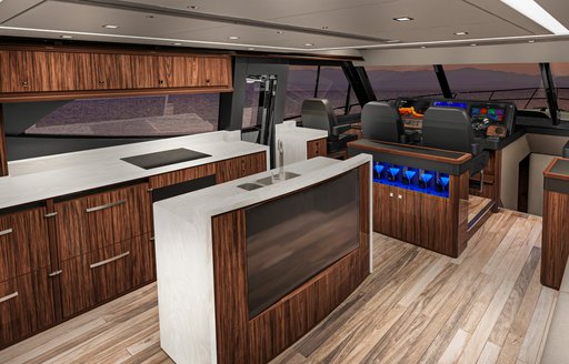 Galley onboard Riviera 645 SUV, sink unit on far side under stretching window and additional kitchen top adjacent.