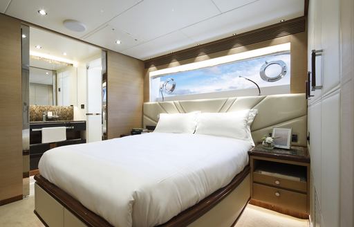 VIP stateroom on Crowned Eagle with large double bed and ambient lighting