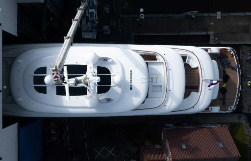 Aerial view looking down on Feadship Project 823, all exterior decks and supersytucture visible.