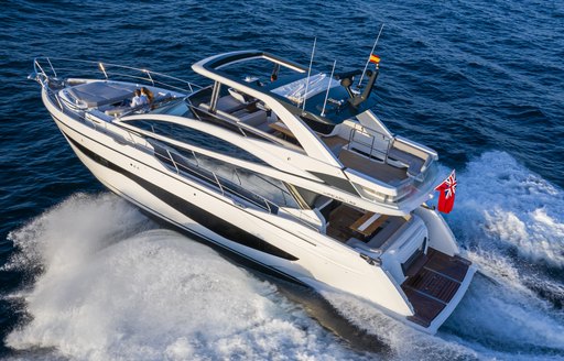 Aft angle view of Pearl 62 flybridge yacht underway, surrounded by sea