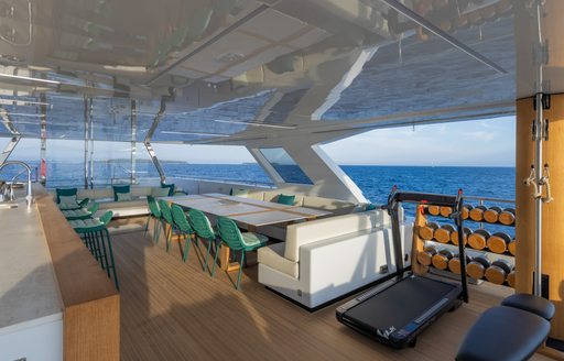  Sundeck with table and gym on Rosetti superyacht EMOCEAN